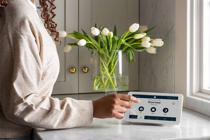 Image of a woman arming the Cove system