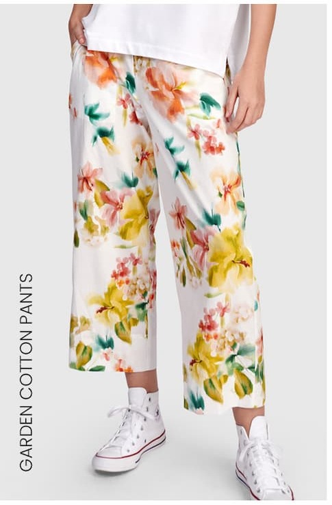 an image of a woman in a white shirt and yellow pants