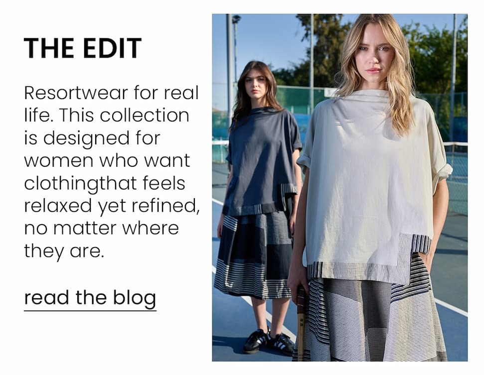 an image of a woman in a dress and sandals standing in front of a bouquet of flowers