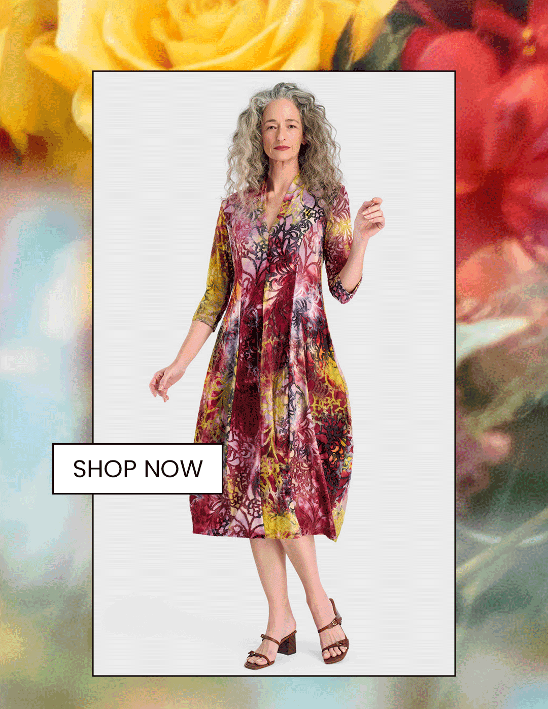 an image of a woman in a dress and sandals standing in front of a bouquet of flowers