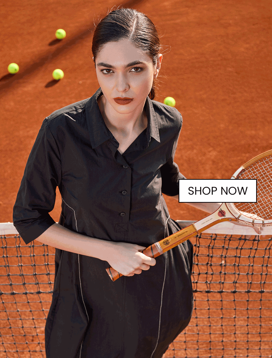 an image of a woman in a dress and sandals standing in front of a bouquet of flowers