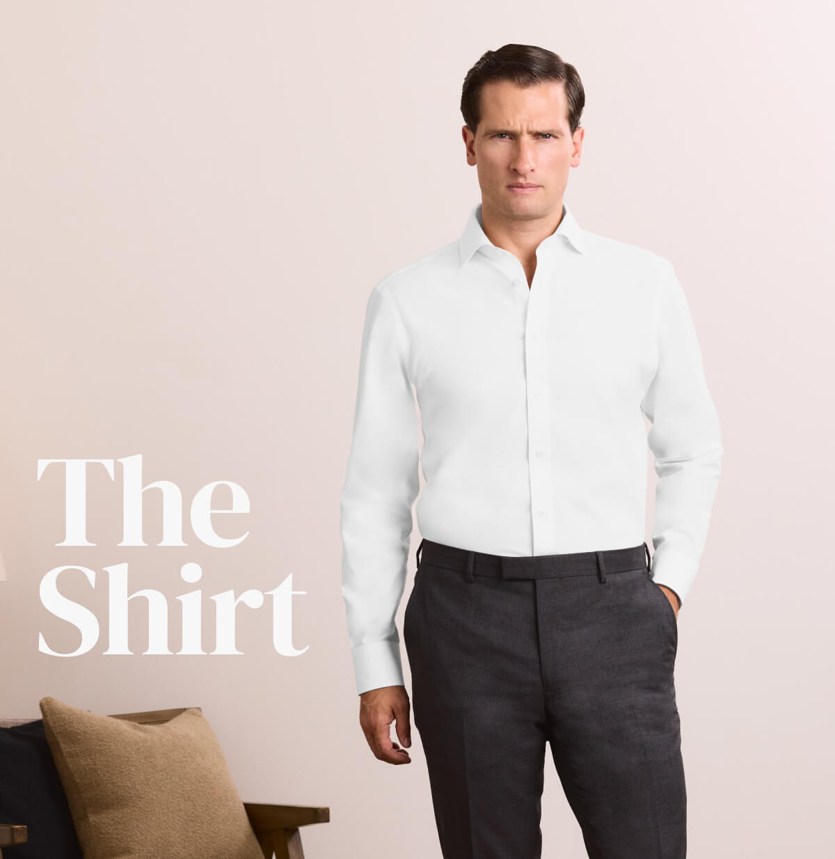 Man wearing white shirt and charcoal trousers