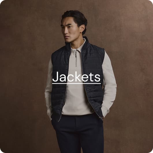 man wearing stone sweatshirt & black gilet