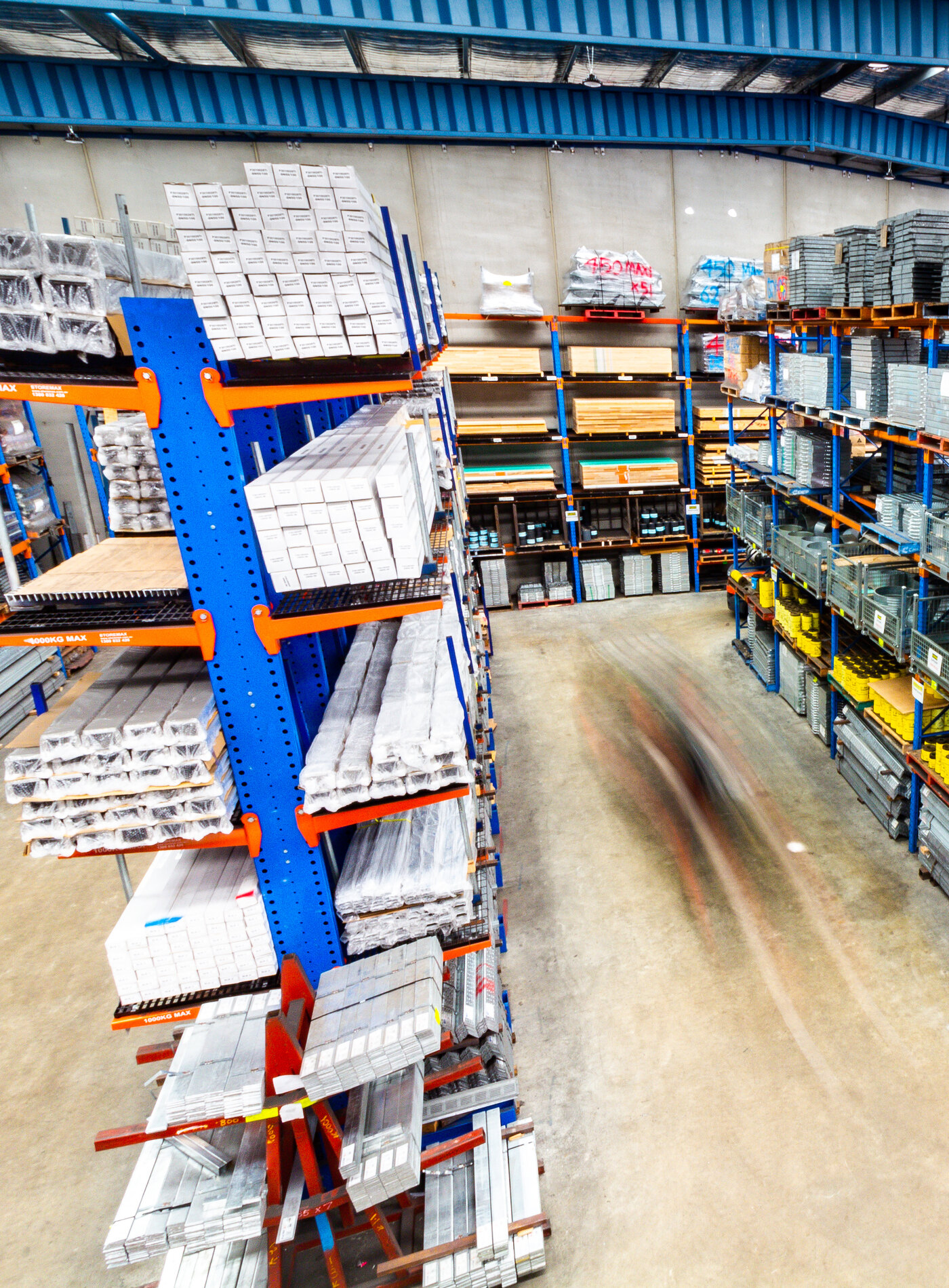 The Vincent Buda & Co. warehouse in Lakemba, racked with lintels, grates and building supplies