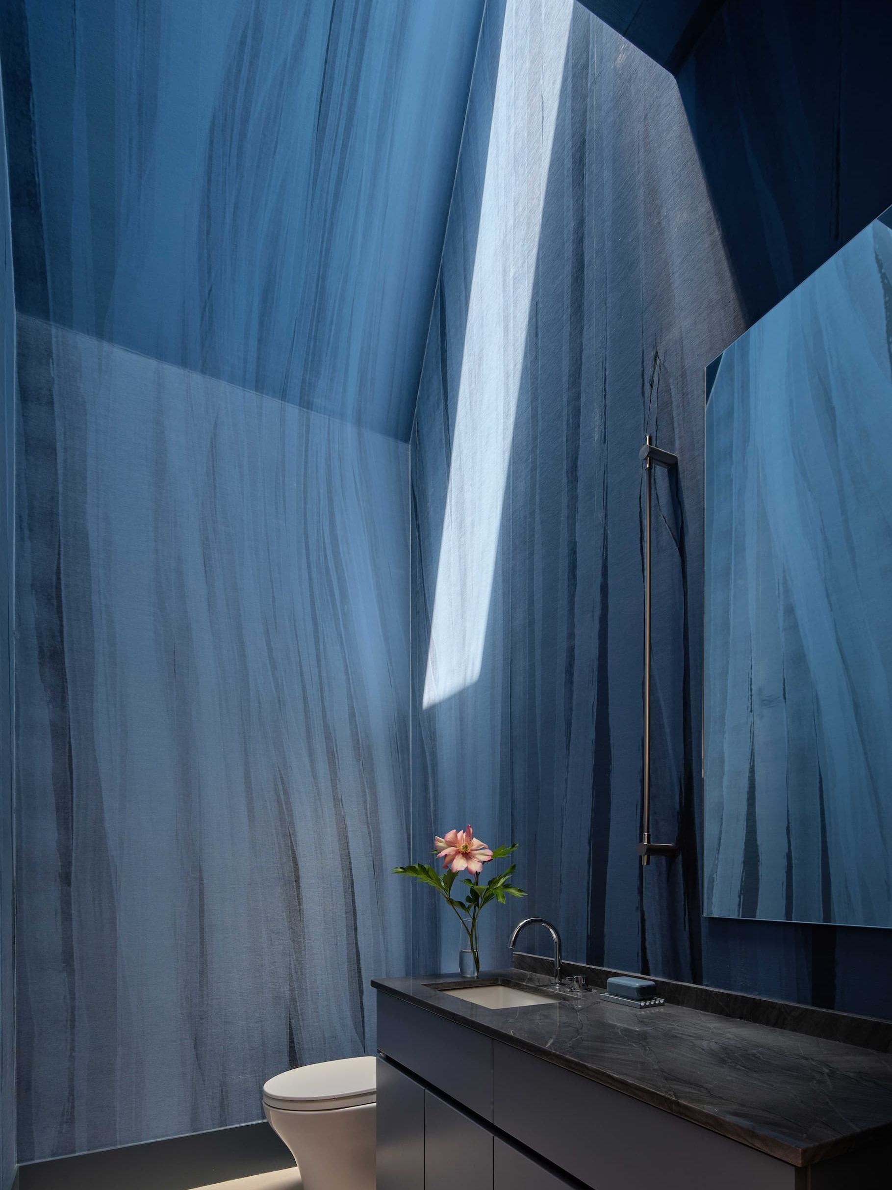 STREAMS | COBALT wallcovering in an angular powder room at The Paradox House in Sonoma, California