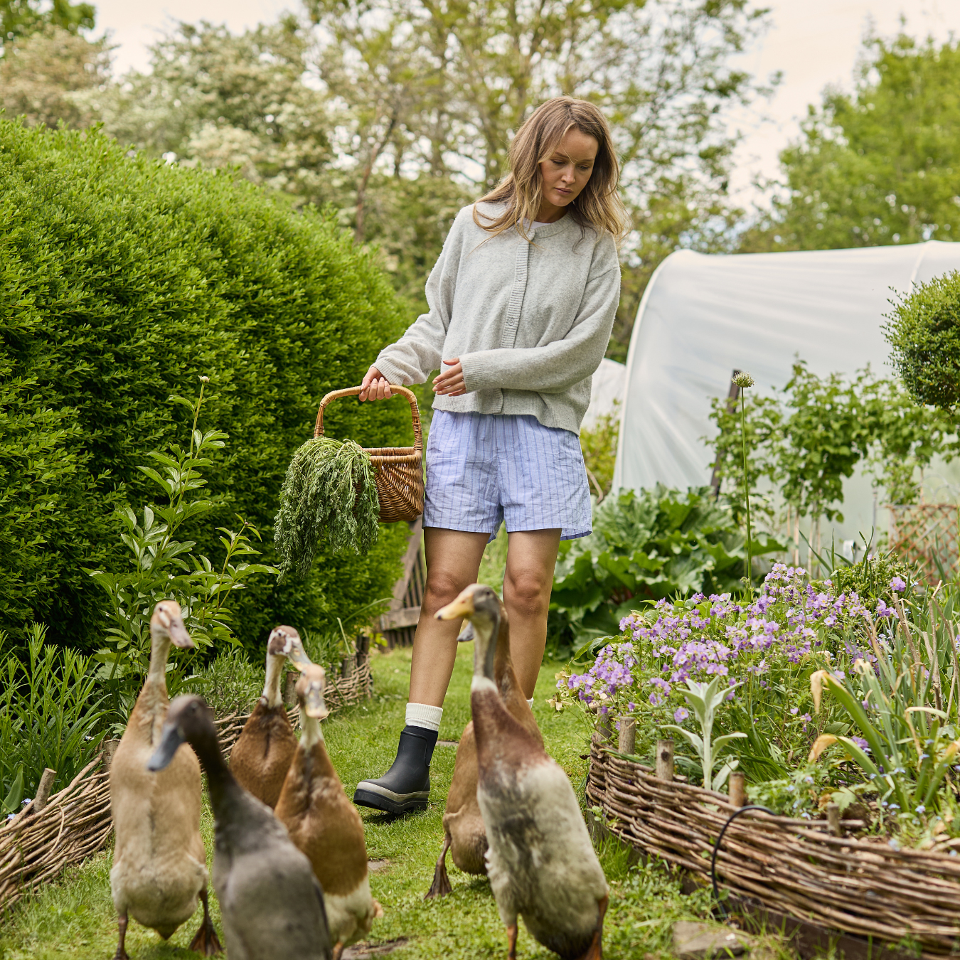 Woman in Garden with Ducks