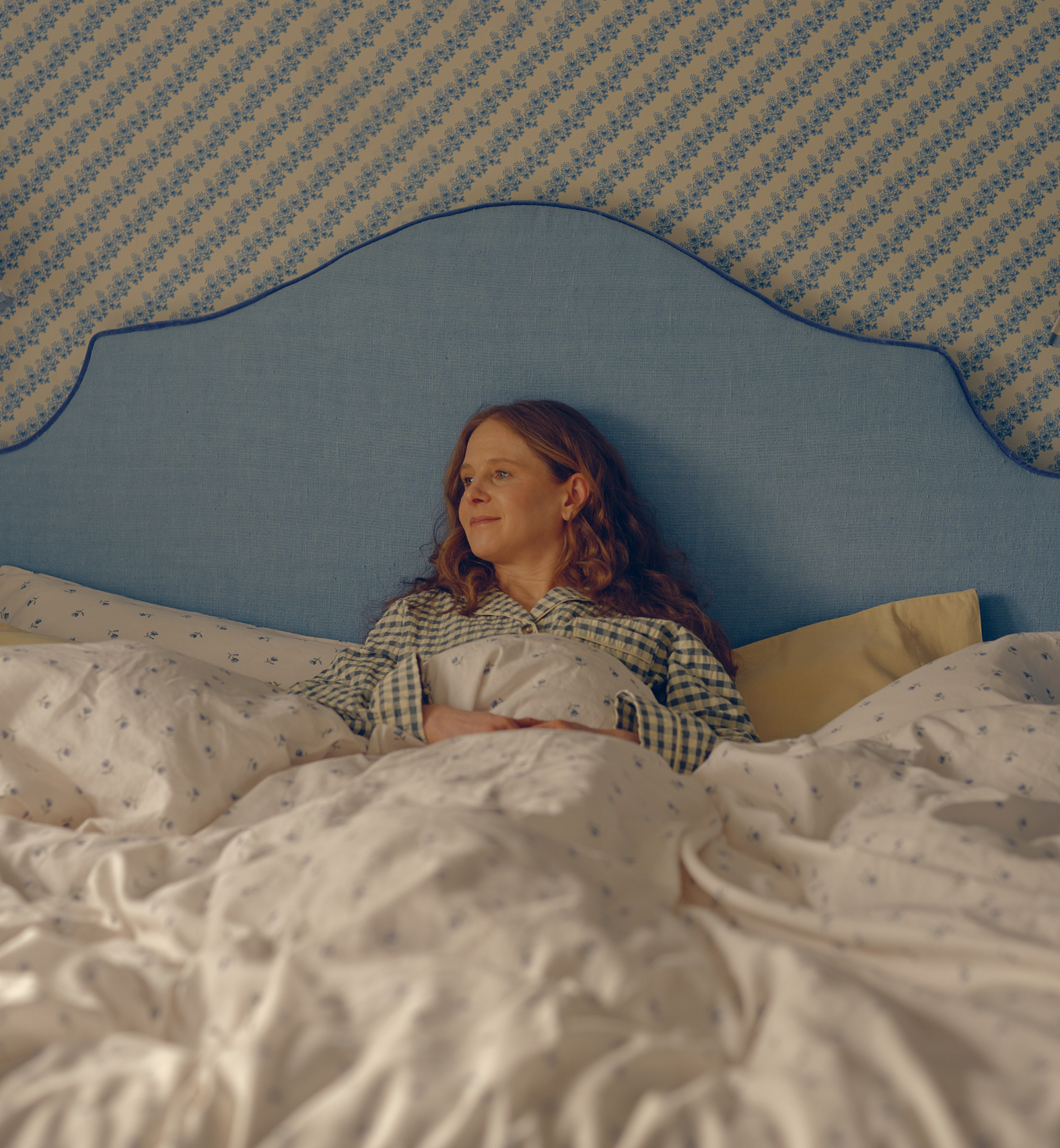 A woman cosy in bed