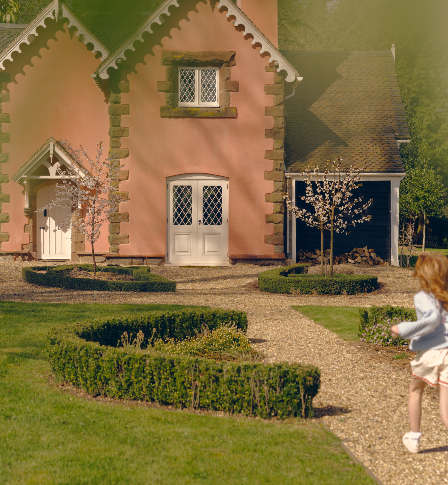 A girl running up to a house