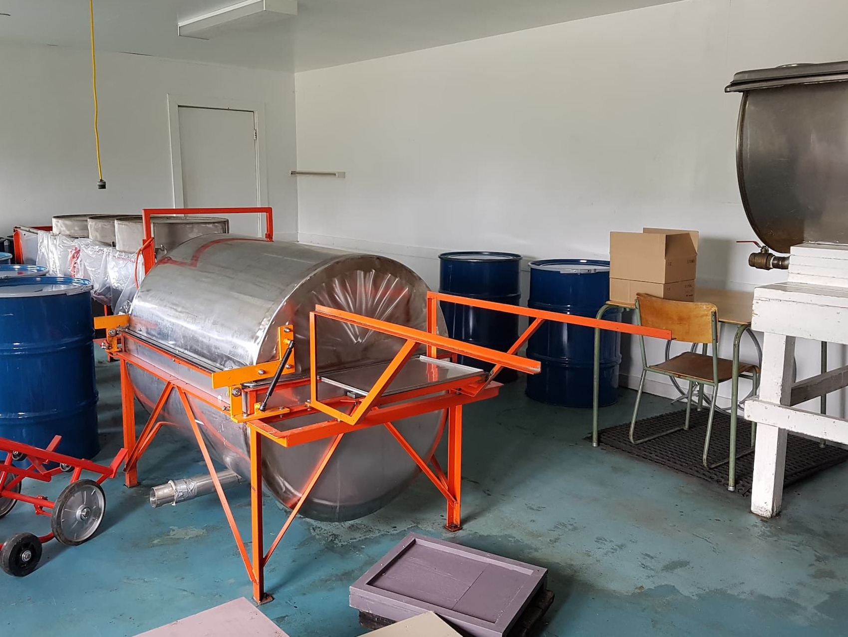 Our old prototype extractor in the center, and our settling tank on the right