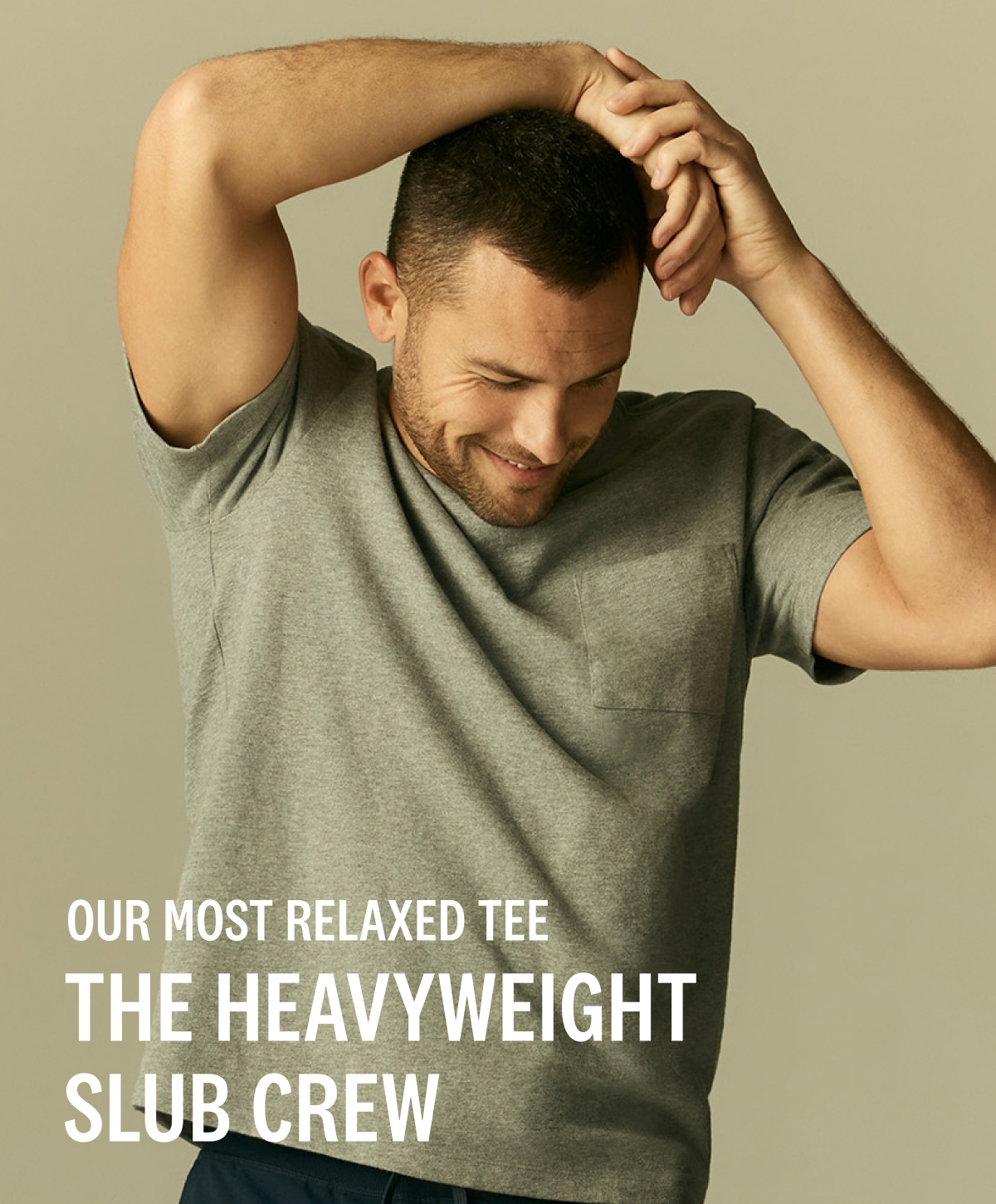 Man wearing Heavyweight Slub T-Shirt in Grey Heather with text "our most relaxed tee the heavyweight Slub crew" 
