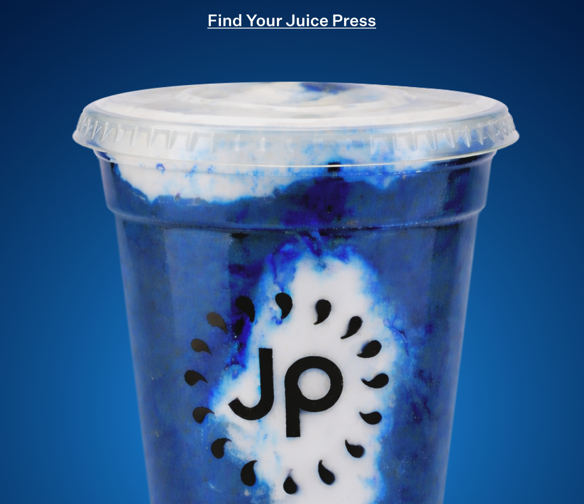 Blue smoothie in a clear plastic cup with the Juice Press logo