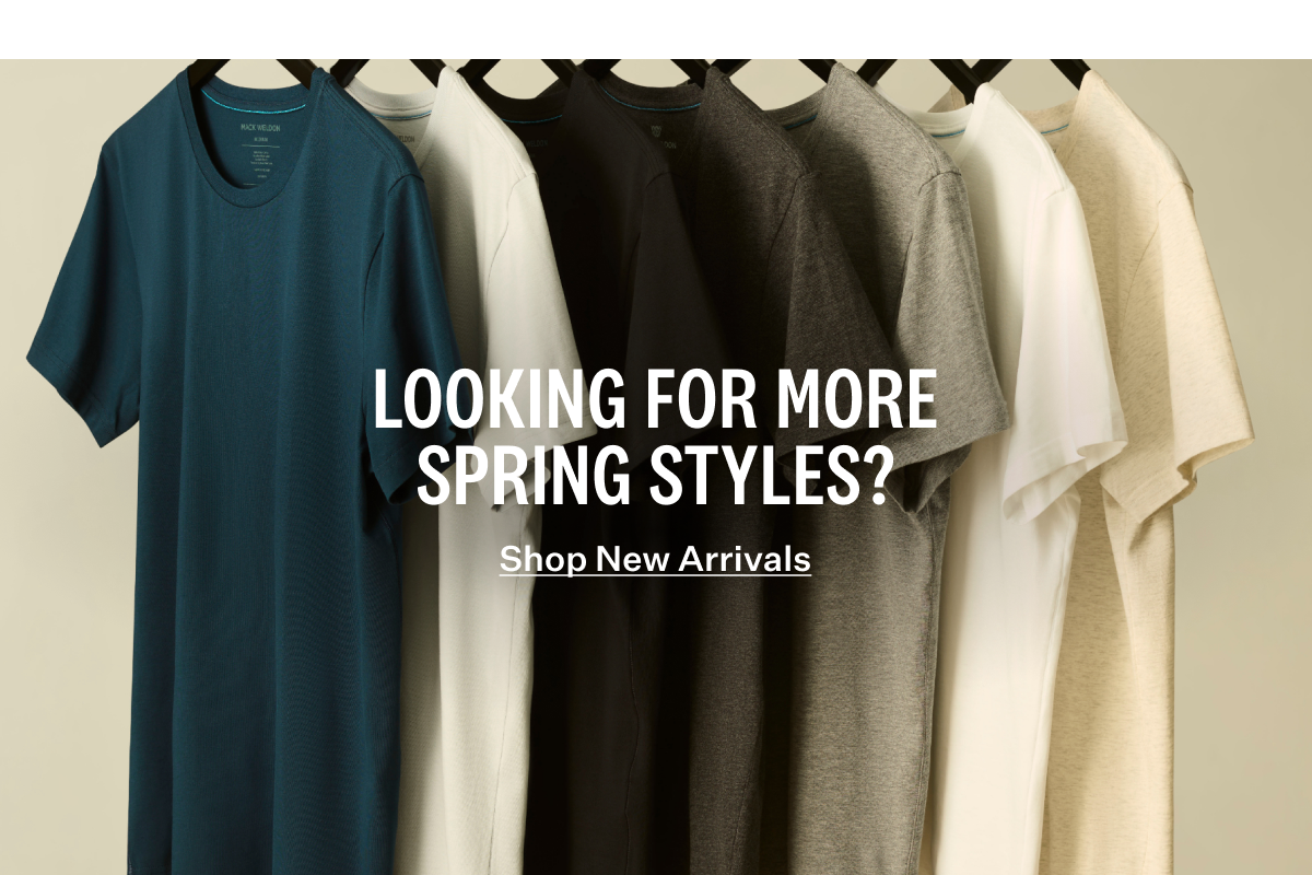 Row of different Mack Weldon shirts hanging on a rack. With text "Looking for more spring styles? Shop New Arrivals." 