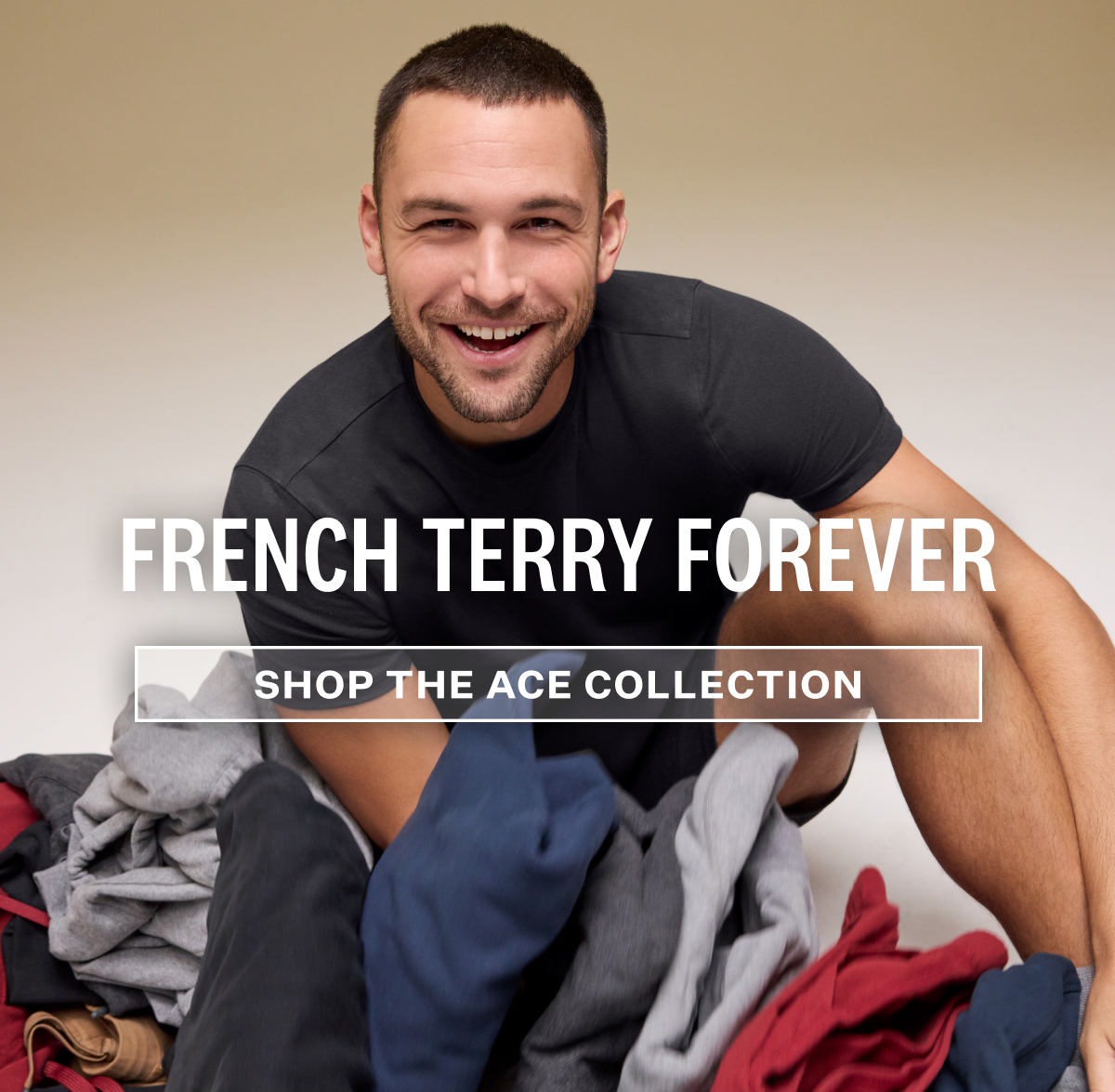 Man sitting in a piled Mack Weldon Ace products