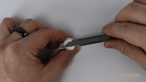 Clipping the attachment onto the knife