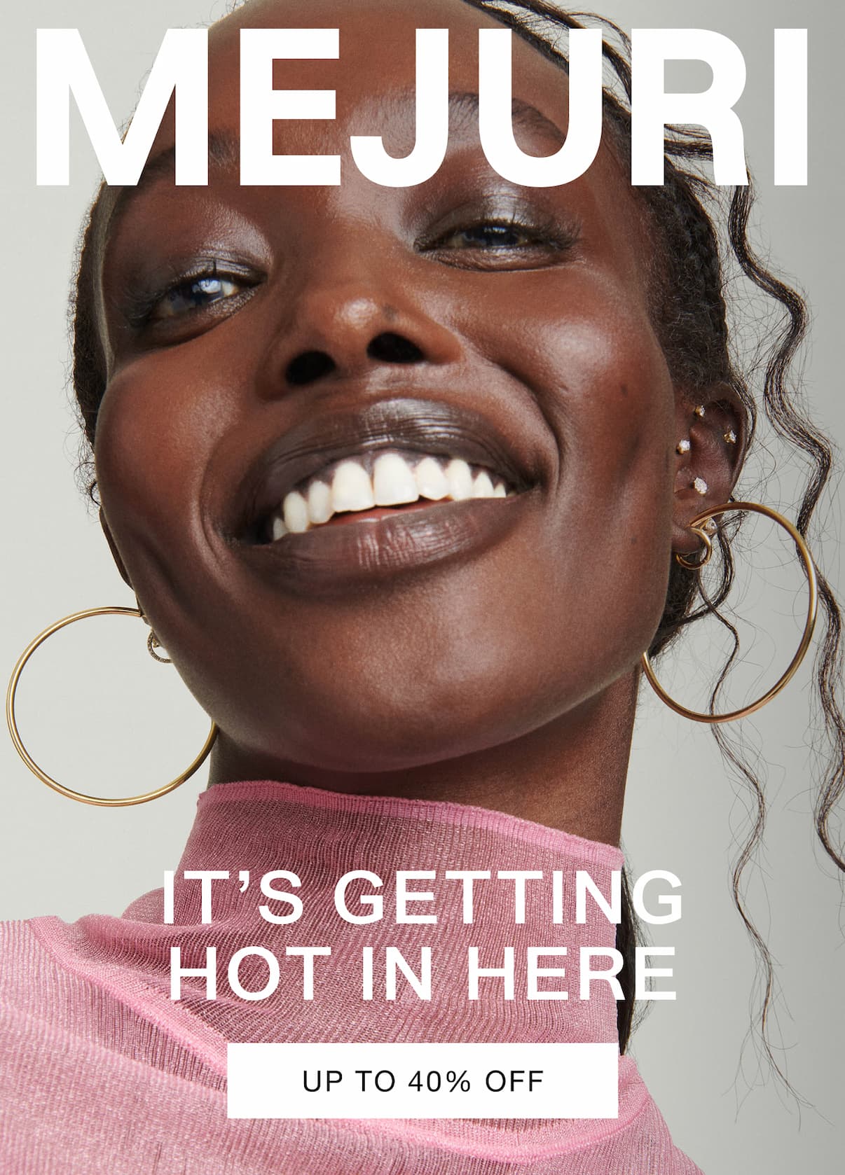 Woman smiling and wearing gold hoop earrings and pearl studs. Text reads: It's Getting Hot In Here — Up to 40% Off. Woman smiling and wearing gold hoop earrings and pearl studs. Text reads: It's Getting Hot In Here — Up to 40% Off.