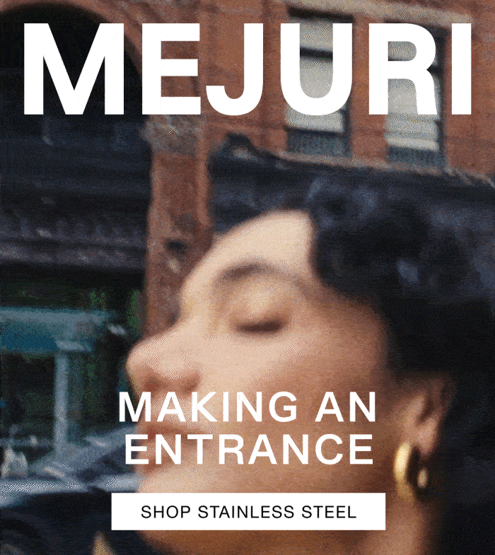 Close-up of a woman's ear wearing a Mejuri gold hoop — Making an Entrance, Shop Stainless Steel. Close-up of a woman's ear wearing a Mejuri gold hoop — Making an Entrance, Shop Stainless Steel.