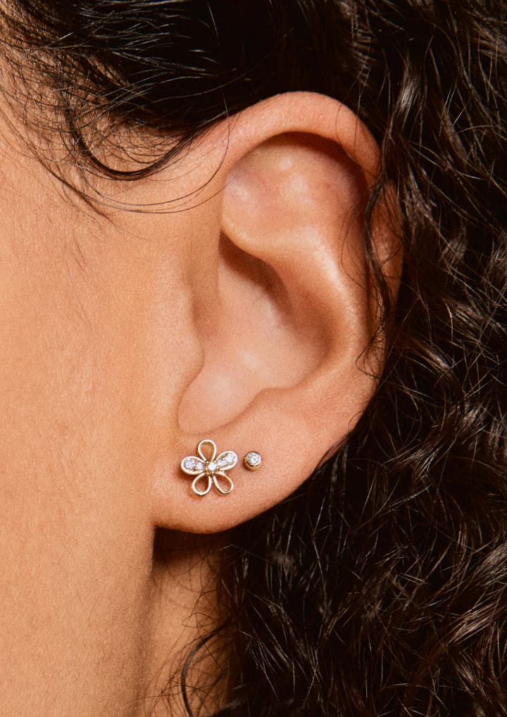 “WE REIMAGINED THE TRADITIONAL FLORAL MOTIF WITH A LIGHTER TOUCH—BALANCING NEGATIVE SPACE AND DIAMONDS FOR SOMETHING THAT FEELS MODERN, PLAYFUL, AND COMPLETELY UNFUSSY.” —Lauren Sehner, Senior Jewelry Designer