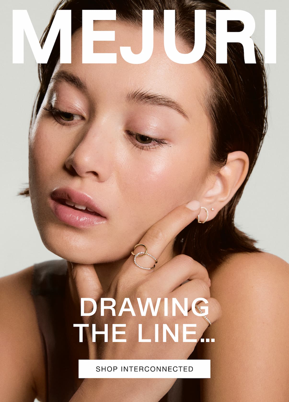 Mejuri. Drawing the Line… and setting it in solid 14k gold with responsibly sourced pavé diamonds. Inspired by the "hand-drawn" stroke of a pen, the Interconnected Collection is designed to look fluid and feel instinctive. Shop Interconnected.