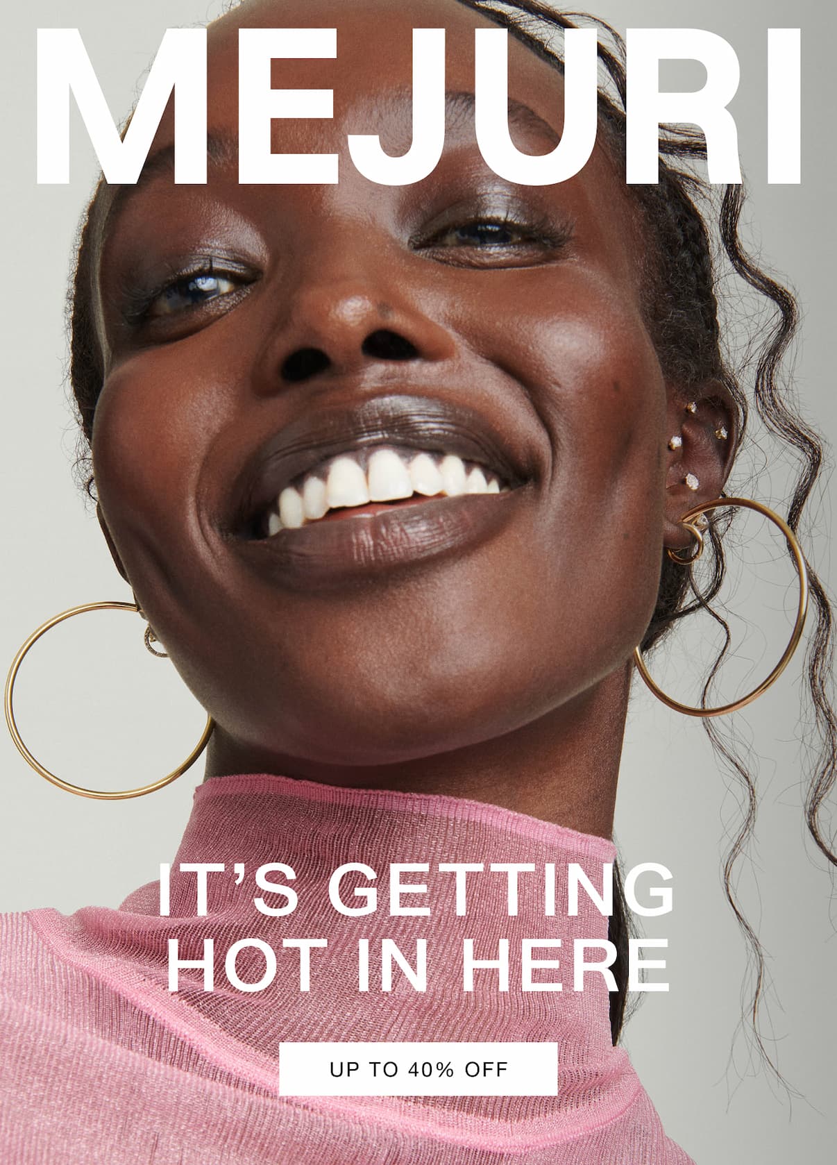 Woman smiling and wearing gold hoop earrings and pearl studs. Text reads: It's Getting Hot In Here — Up to 40% Off.