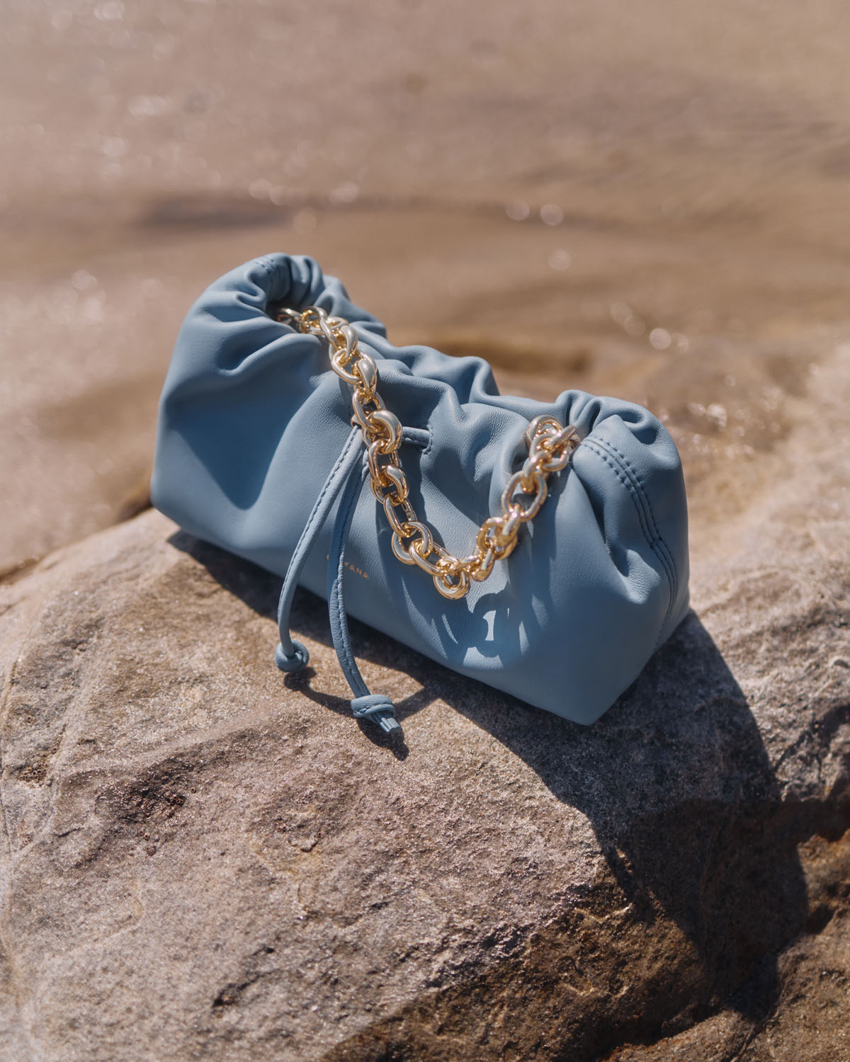 Nano Dia Bag Azure Blue with attached chain strap