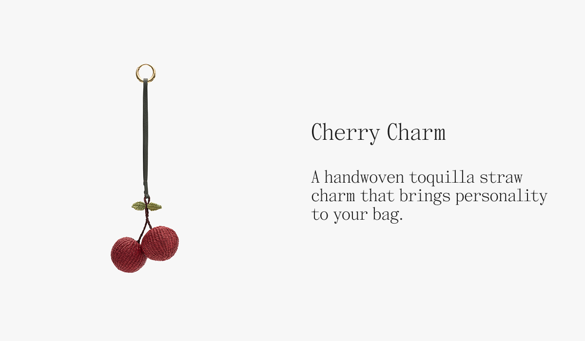 Cherry Charm A handwoven toquilla straw charm that brings personality to your bag.
