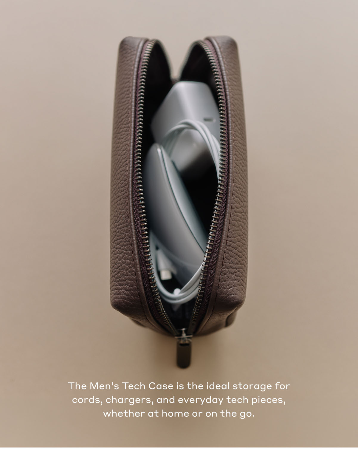 The Men's Tech Case is the ideal storage for cards, chargers, and everyday tech pieces, whether at home or on the go.