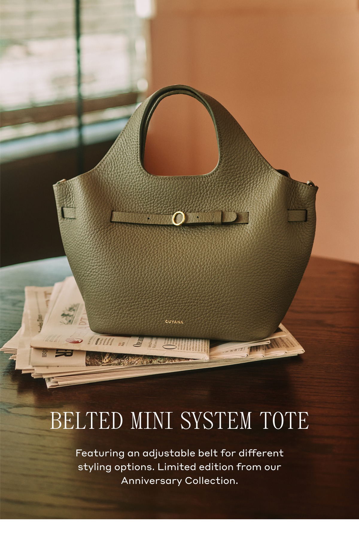BELTED MINI SYSTEM TOTE Featuring an adjustable belt for different styling options. Limited edition from our Anniversary Collection.
