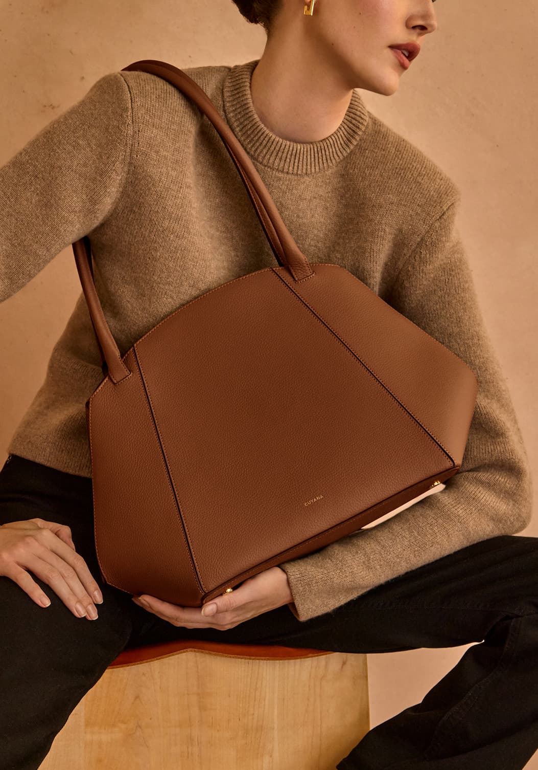 You step out of the office to have lunch with a client. The striking silhouette fits in anywhere and doesn't look like a tired work bag you've been using since the sun came up.