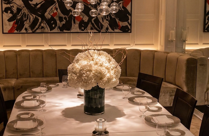 an image of two champagne flutes and two glasses of champagne on a table