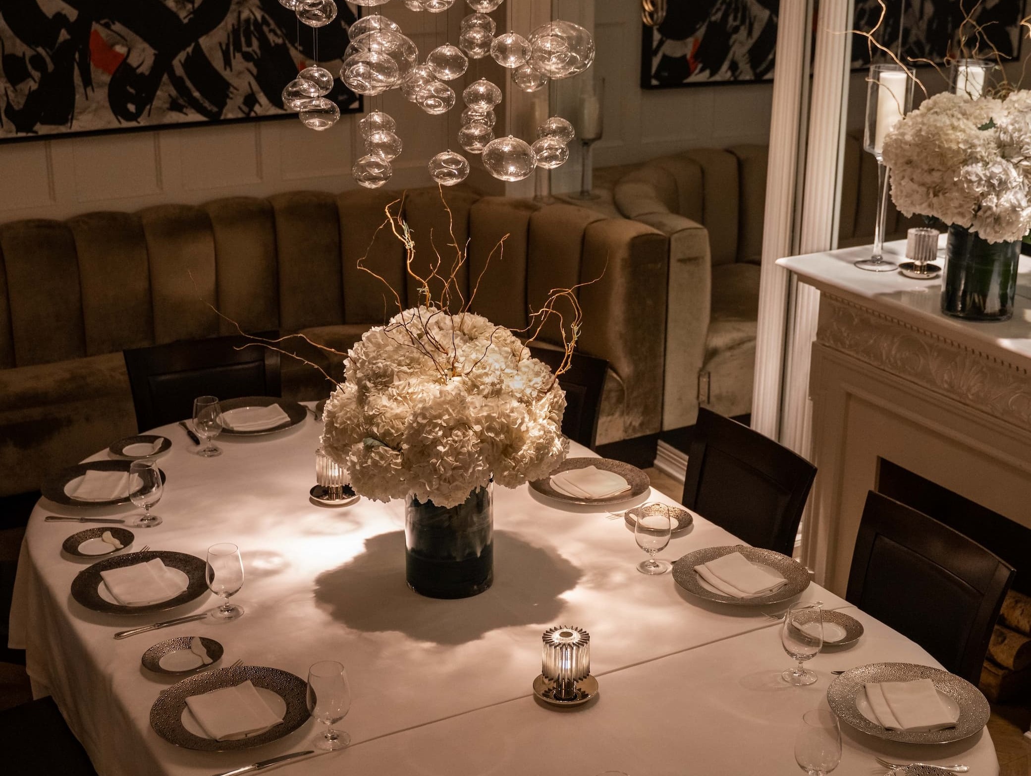 an image of two champagne flutes and two glasses of champagne on a table