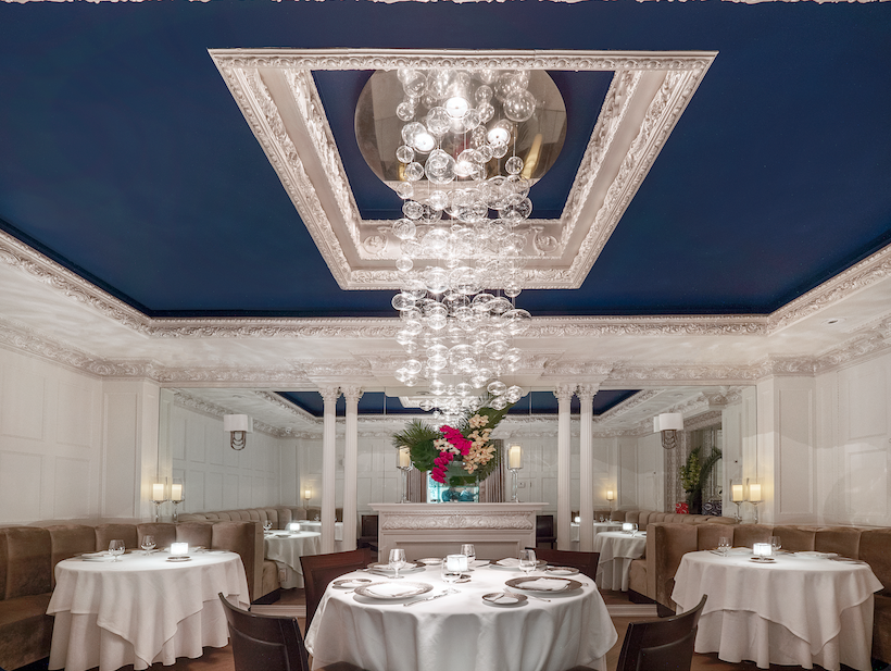 an image of two champagne flutes and two glasses of champagne on a table