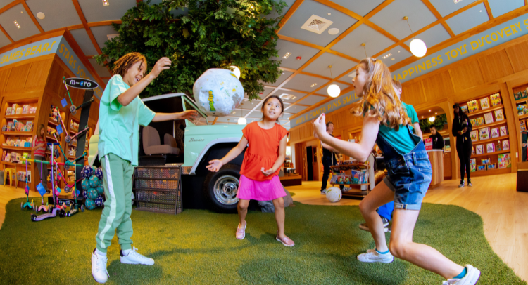 Kids playing soccer-inspired games inside CAMP