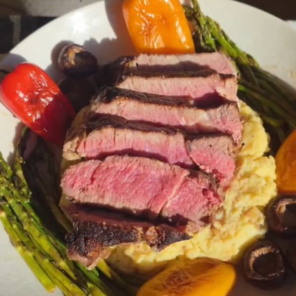 Shout Out: 12 oz Ribeye on a bed of potatoes with peppers