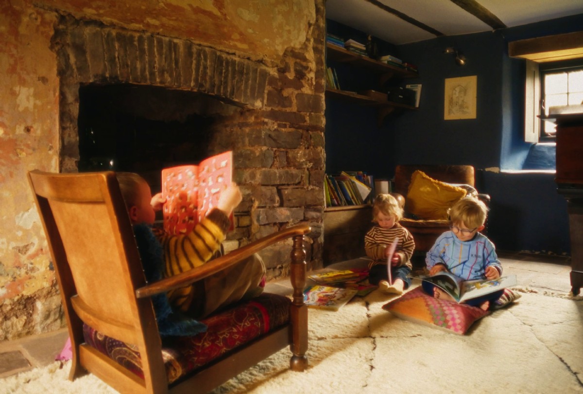 The children sat reading beside the fire at Celestia