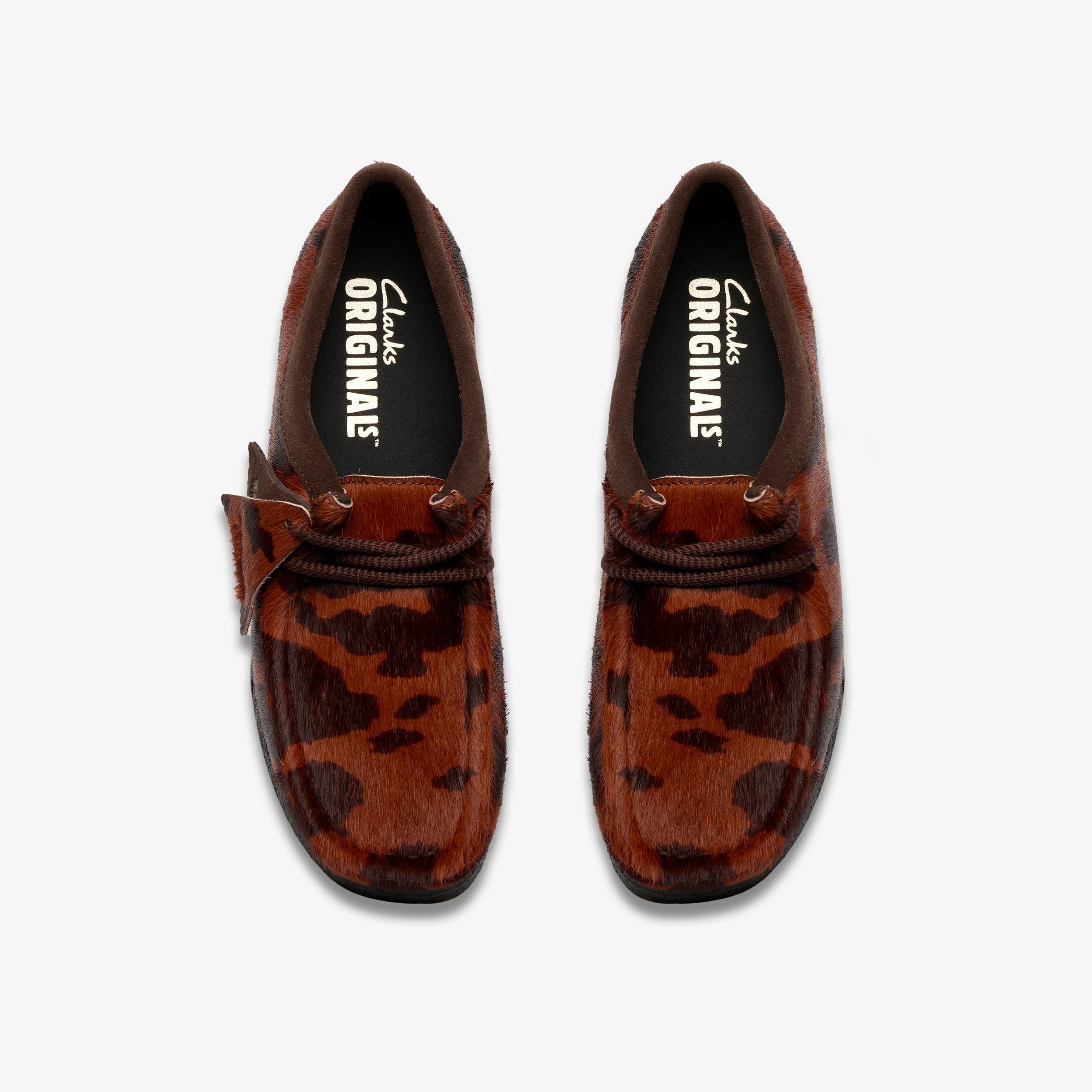 Shop Wallabee. Brown Cow Print