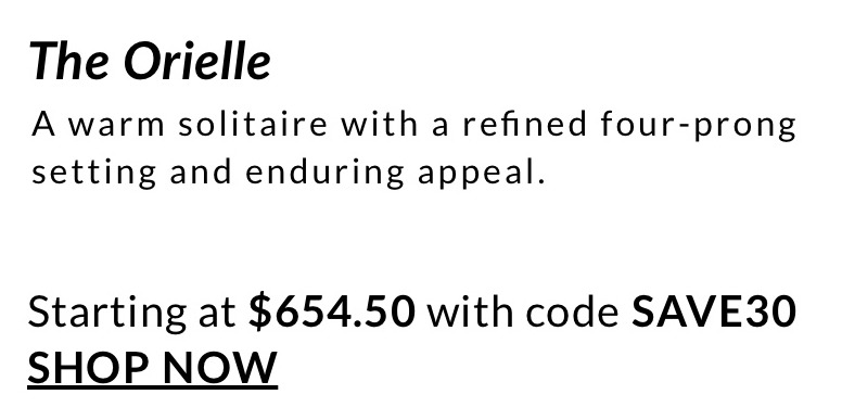 A warm solitaire with a refined four-prong setting and enduring appeal.  