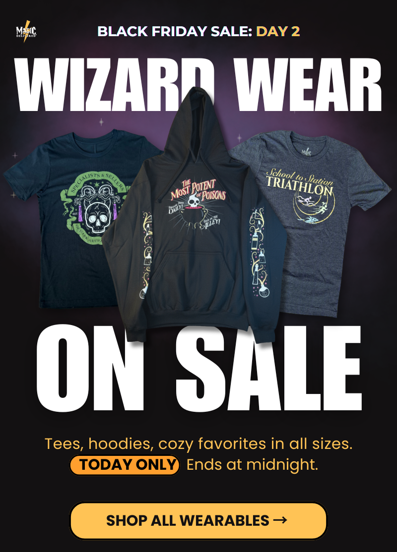 Day 2 Wearables sale hero. Three featured tops on gradient backdrop. Copy: Tees, hoodies, cozy favorites in fan sizes. Today only. Ends at midnight. Button: Shop All Wearables.