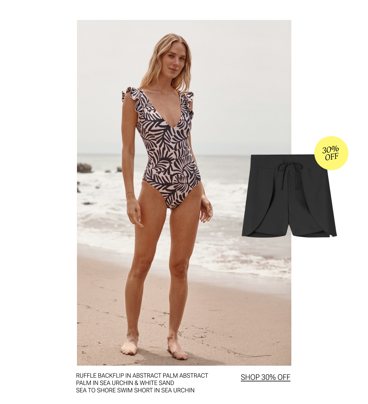 Model in black and white palm printed one piece swimsuit