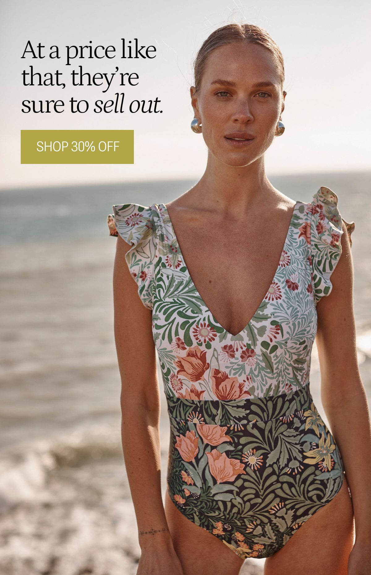 Model in floral printed one piece wrap swimsuit