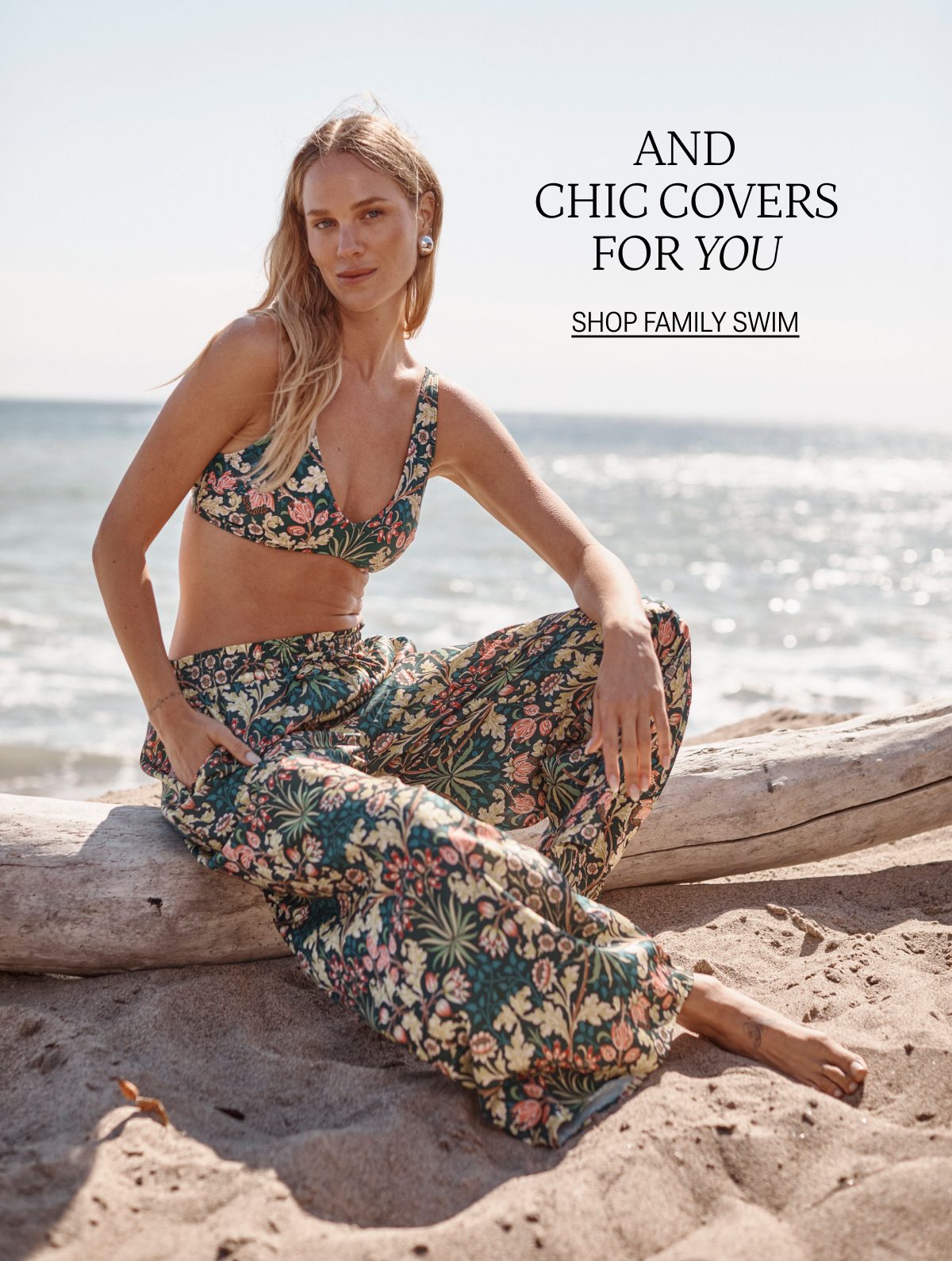 Model wearing a floral printed bikini and matching palazzo pants on the beach