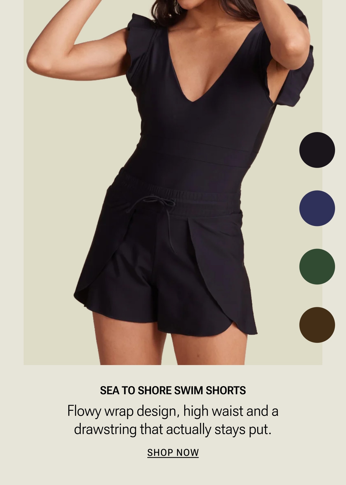 Modle in black one piece swimsuit and matching swim shorts