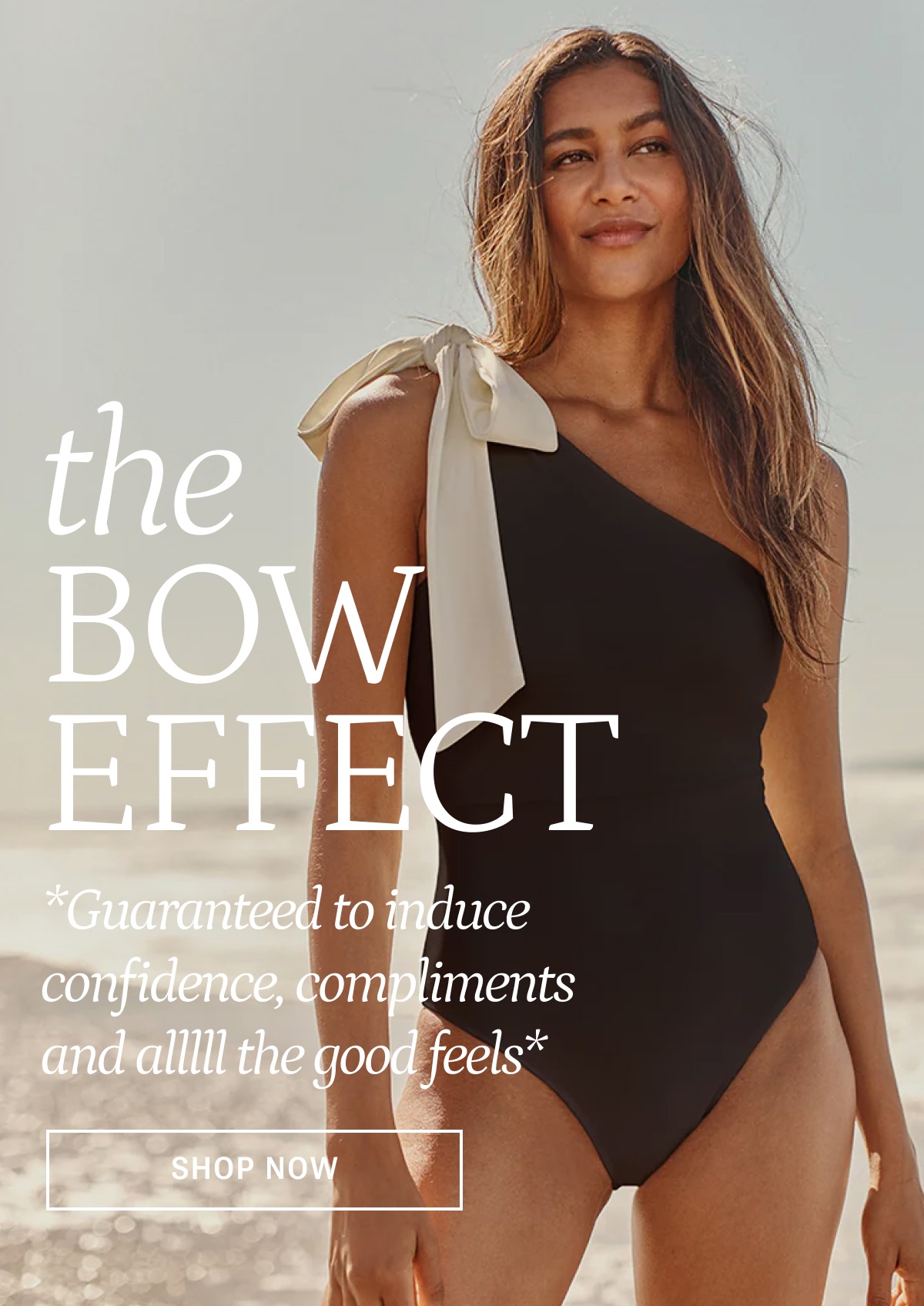 Model in white and black bow topped one piece swimsuit