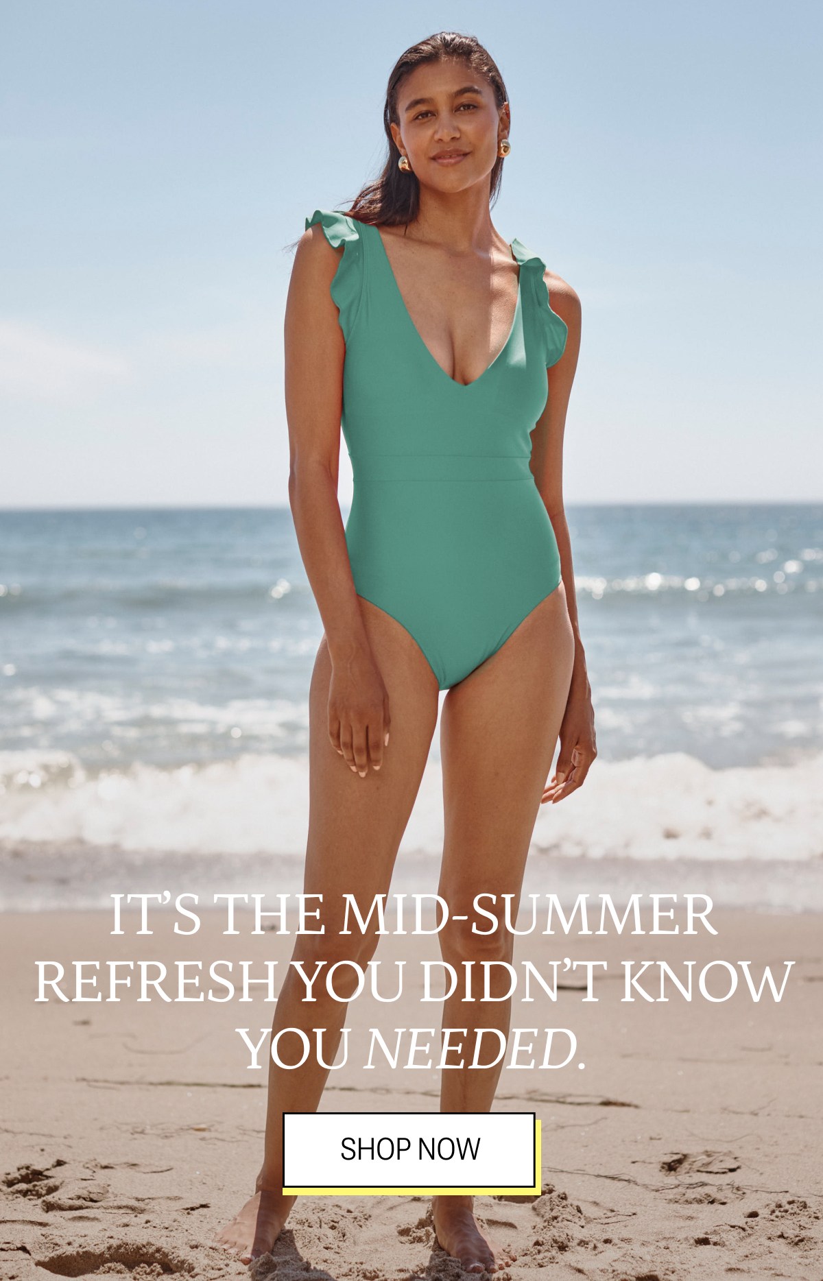 Model wearing a spring green ruffle one piece swimsuit 