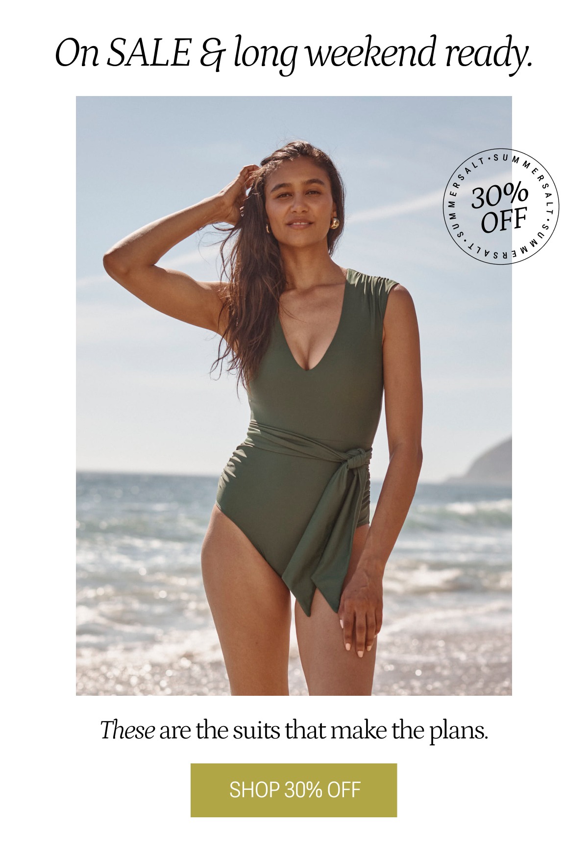 Model in olive green breaker belted backflip