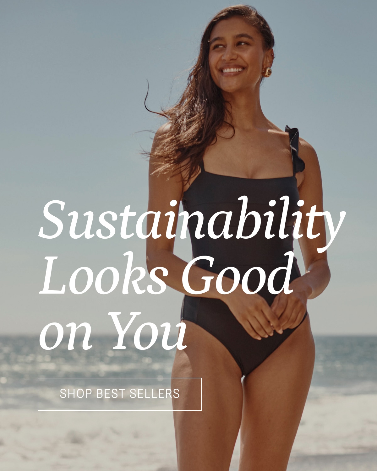 Model in black ruffle one piece swimsuit