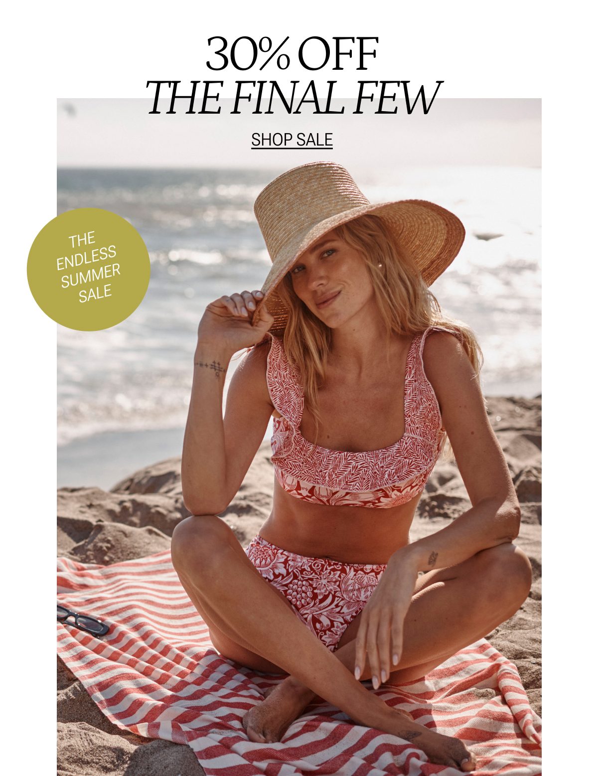 Model in floral printed bikini top and bottom on the beach