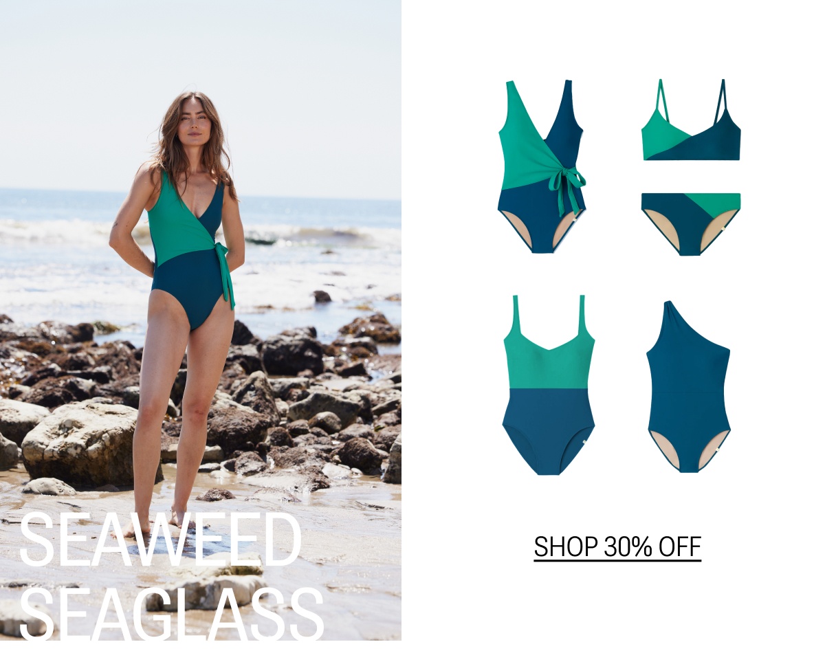 Model in green and blue one piece swimsuit