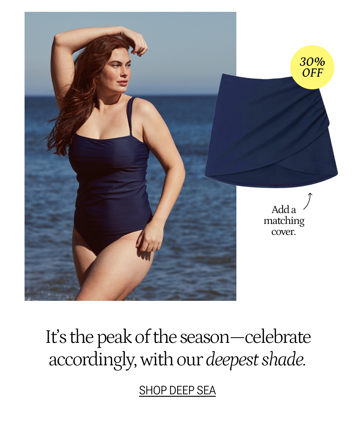 Model wearing a navy blue one piece swimsuit