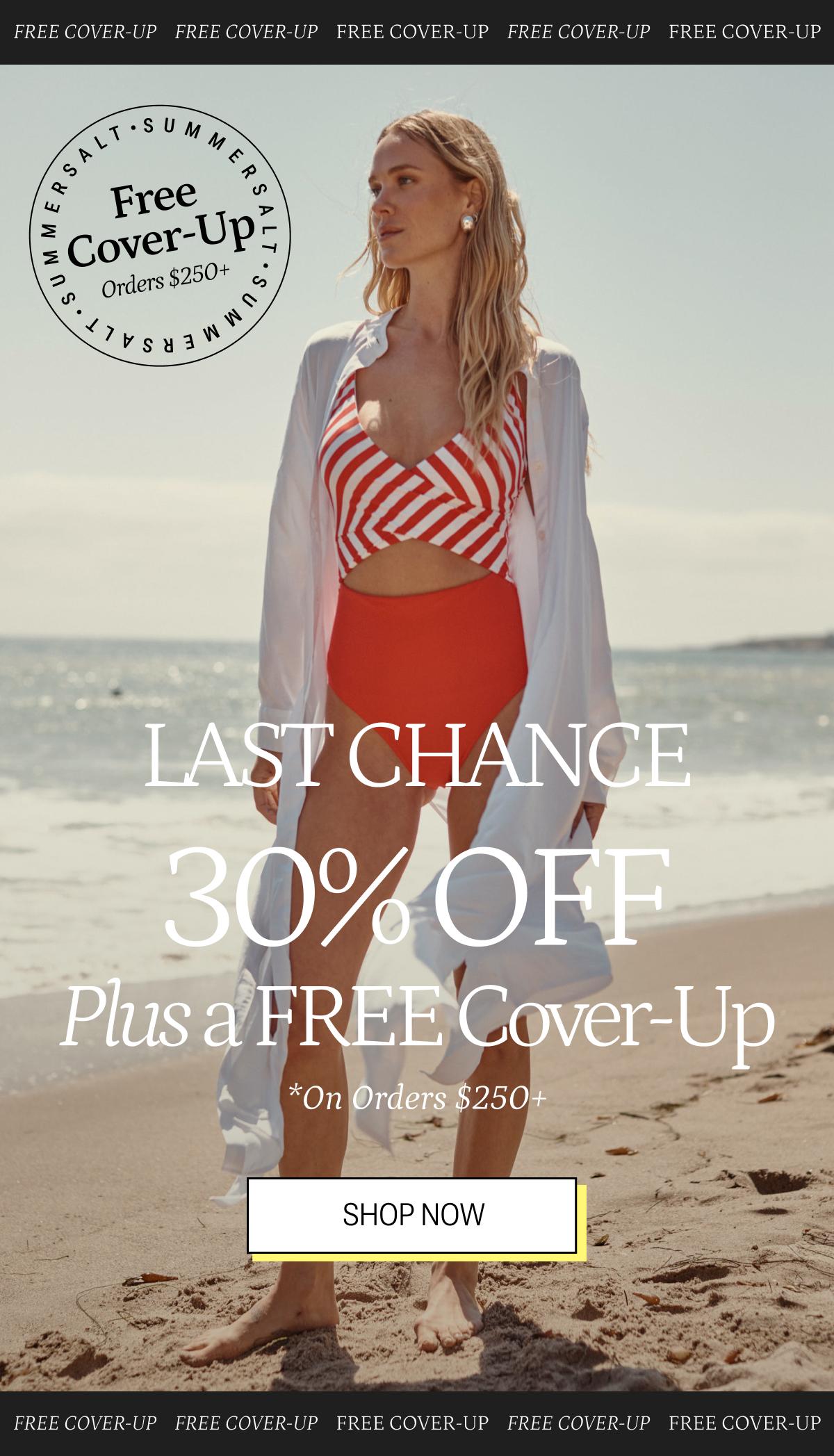 Model wearing a striped one piece swimsuit and white cover-up Model wearing a striped one piece swimsuit and white cover-up