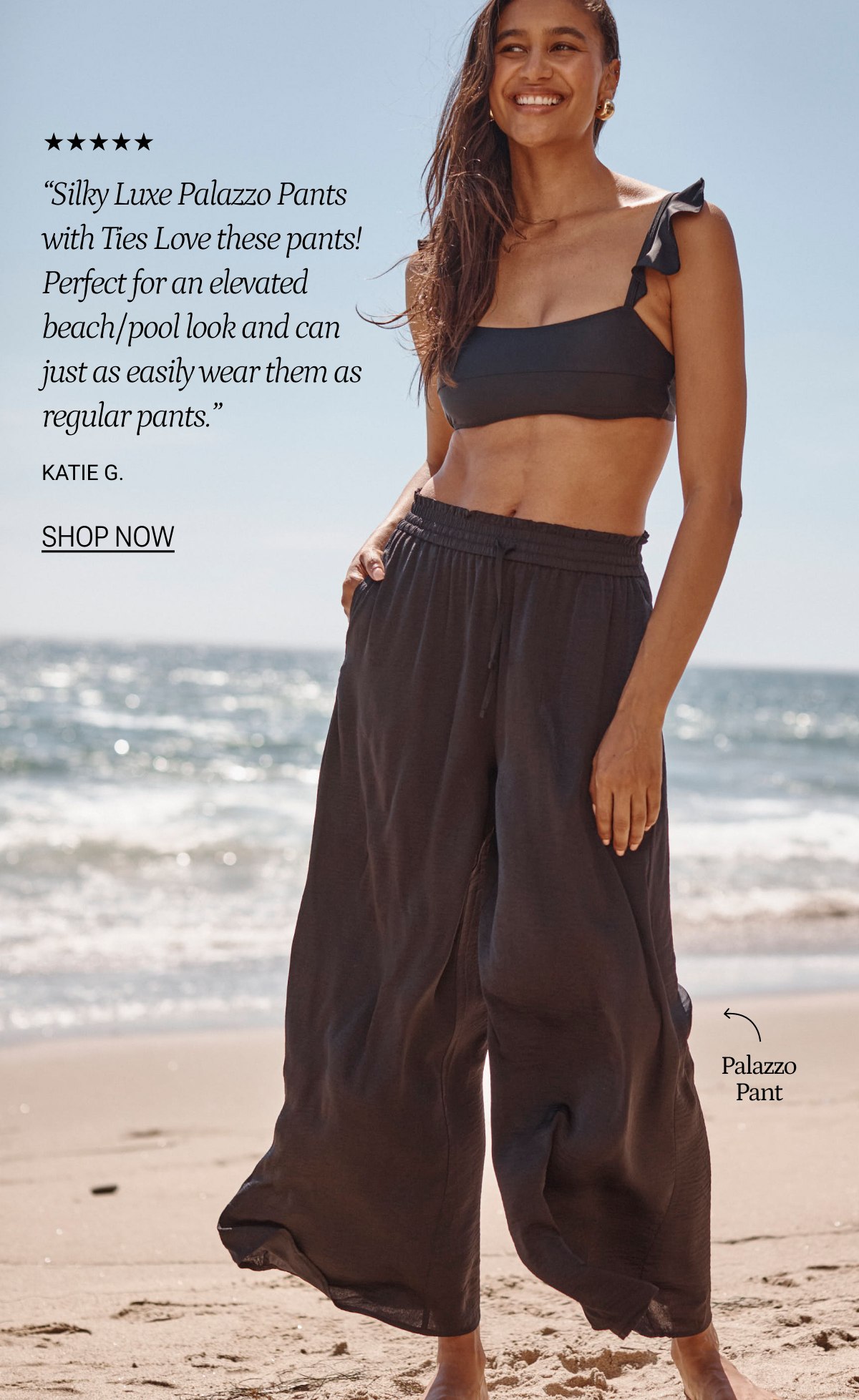 Model wearing ruffle bikini and matching palazzo pants on the shoreline